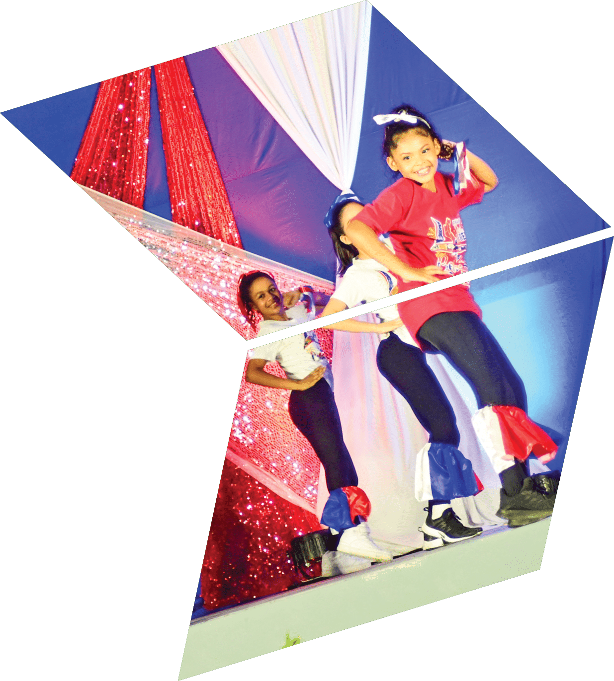 A group of young girls are performing on stage. Description generated by AI