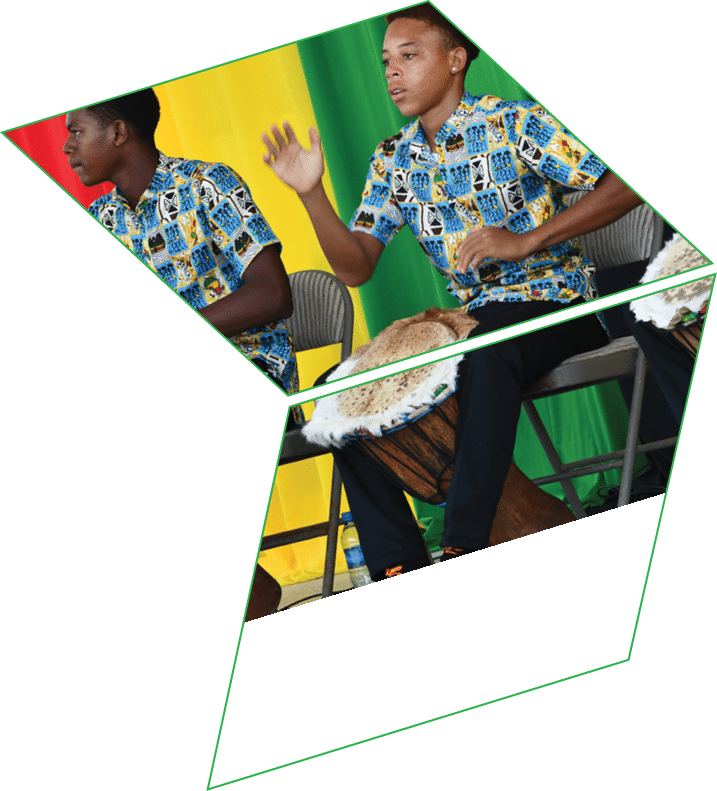 Four men wearing colorful shirts and holding drums. Description generated by AI