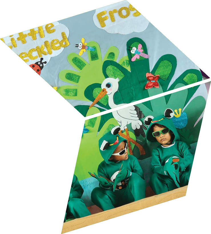 A group of children in green costumes sitting on a mat. Description generated by AI