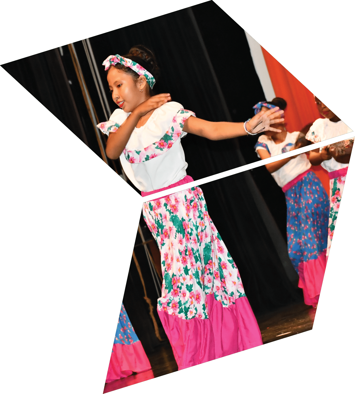 Three girls in colorful dresses are dancing on stage. Description generated by AI